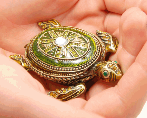 Green Turtle Cremation Keepsake shown in hands